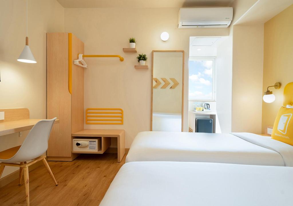 Postel nebo postele na pokoji v ubytování Bloom Hotel - Jayanagar