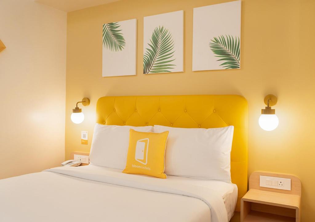 Postel nebo postele na pokoji v ubytování Bloom Hotel - Jayanagar