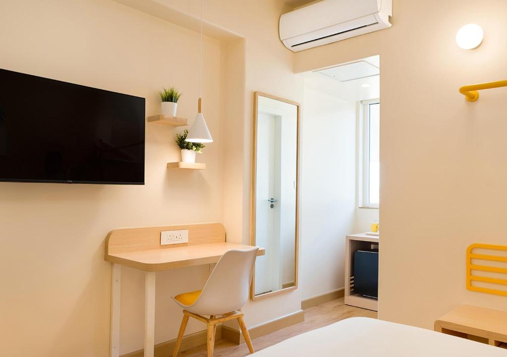 TV a/nebo společenská místnost v ubytování Bloom Hotel - Jayanagar