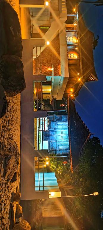 an aerial view of a building at night at Seabreeze Marari in Alleppey