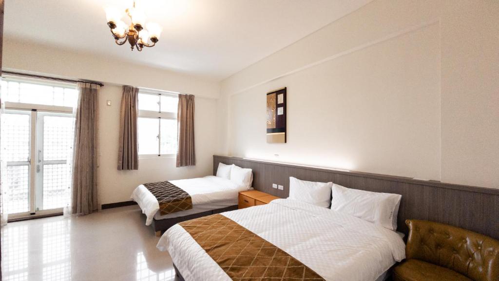 Postel nebo postele na pokoji v ubytování Yearning Homestay