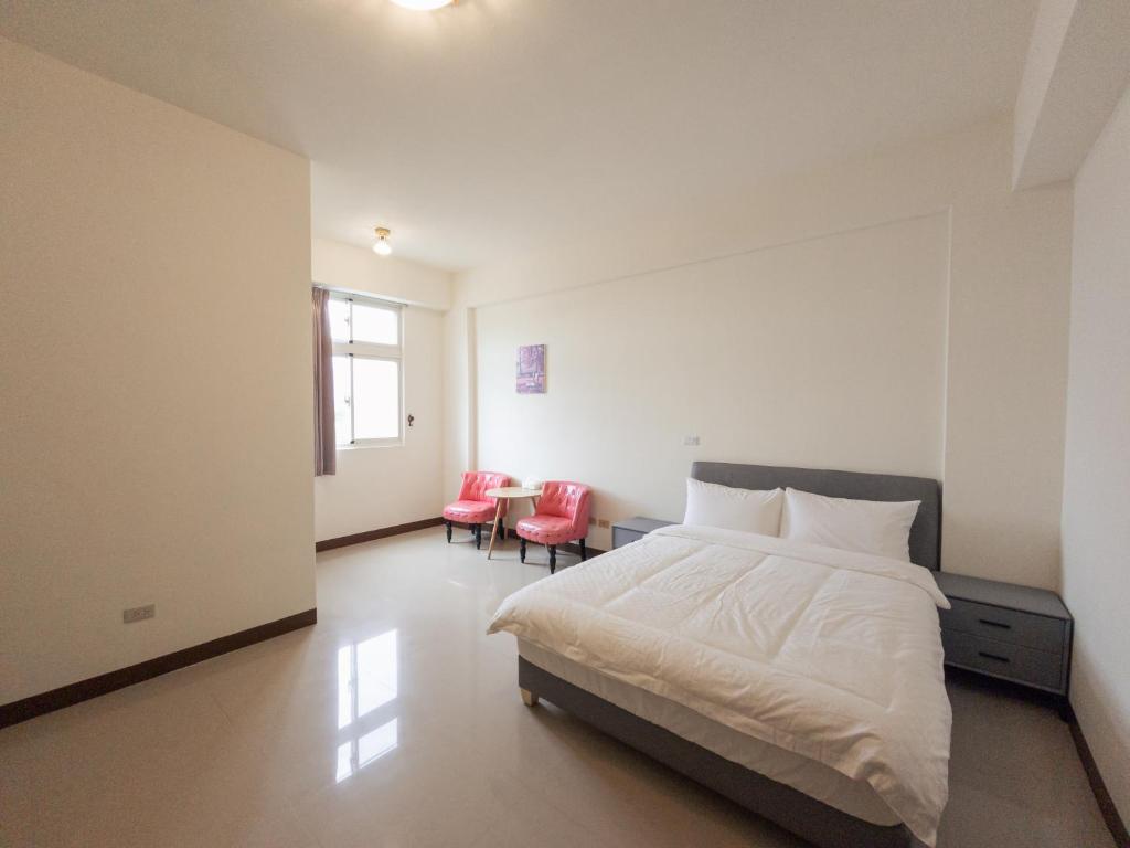 Postel nebo postele na pokoji v ubytování Yearning Homestay