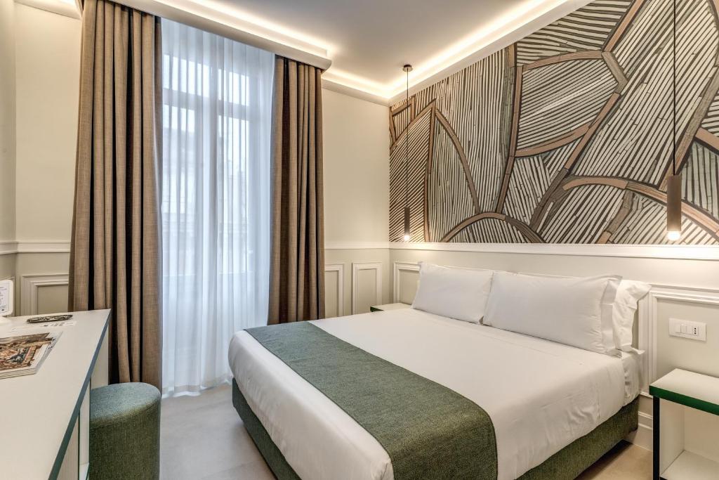 Ένα ή περισσότερα κρεβάτια σε δωμάτιο στο Relais Marco Polo