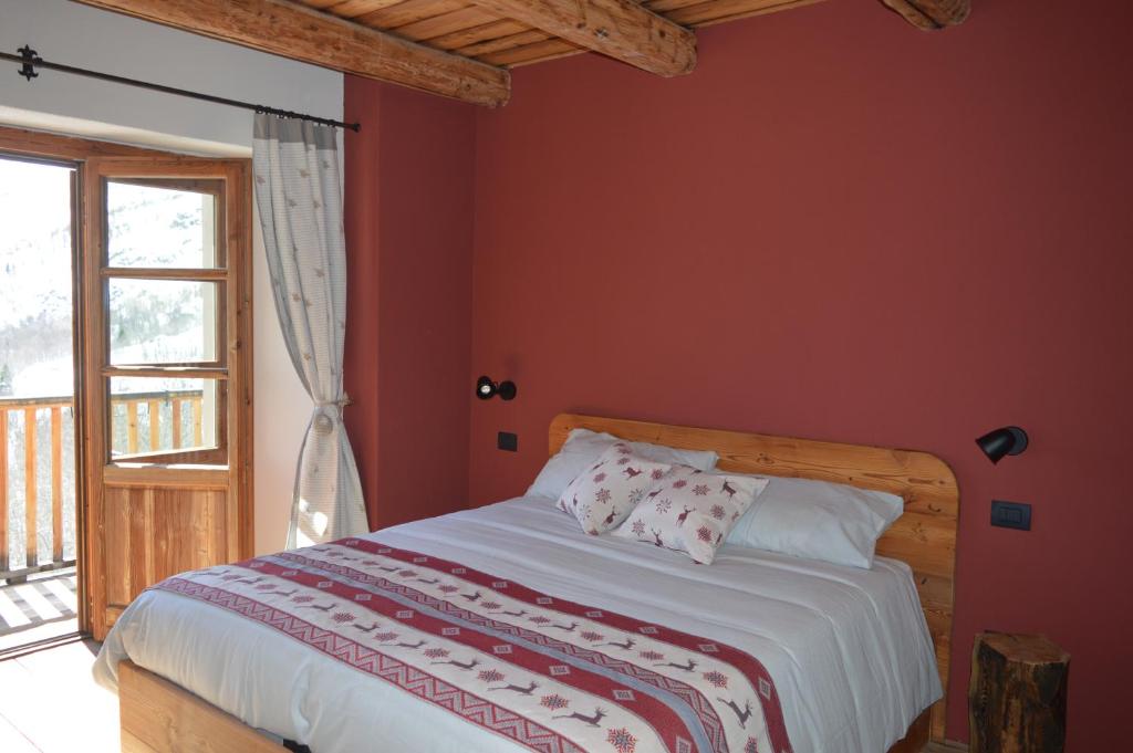 Postel nebo postele na pokoji v ubytování Rifugio di çhiappera