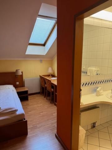 Postel nebo postele na pokoji v ubytování Gasthof Franzl