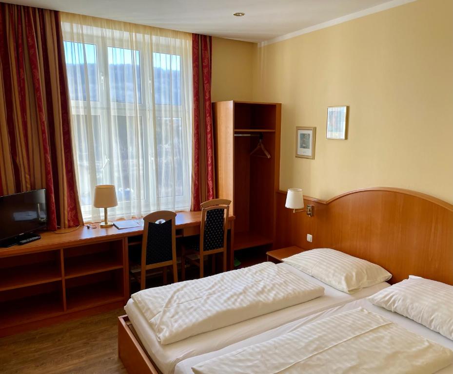 Postel nebo postele na pokoji v ubytování Gasthof Franzl