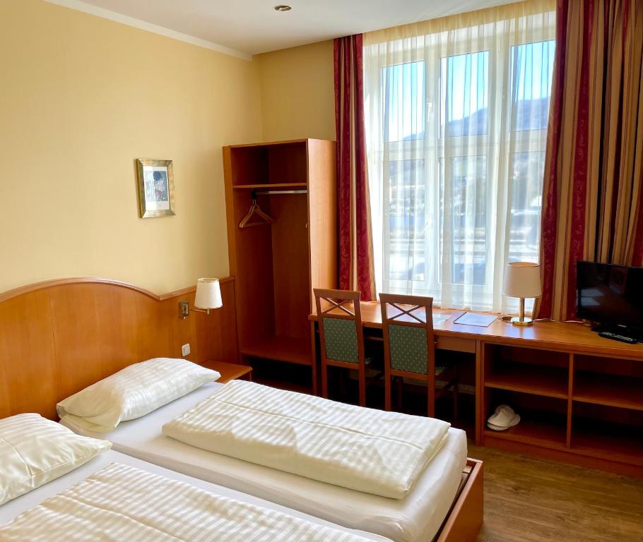 Postel nebo postele na pokoji v ubytování Gasthof Franzl