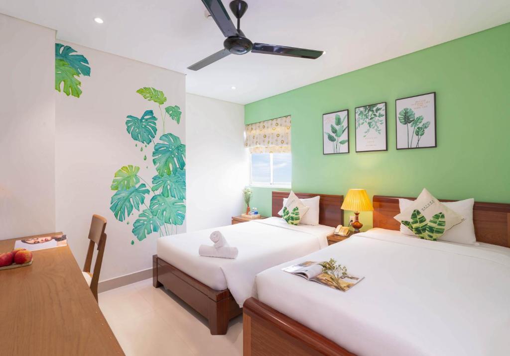 Voodi või voodid majutusasutuse Doha Central Bliss Danang Hotel by Haviland toas