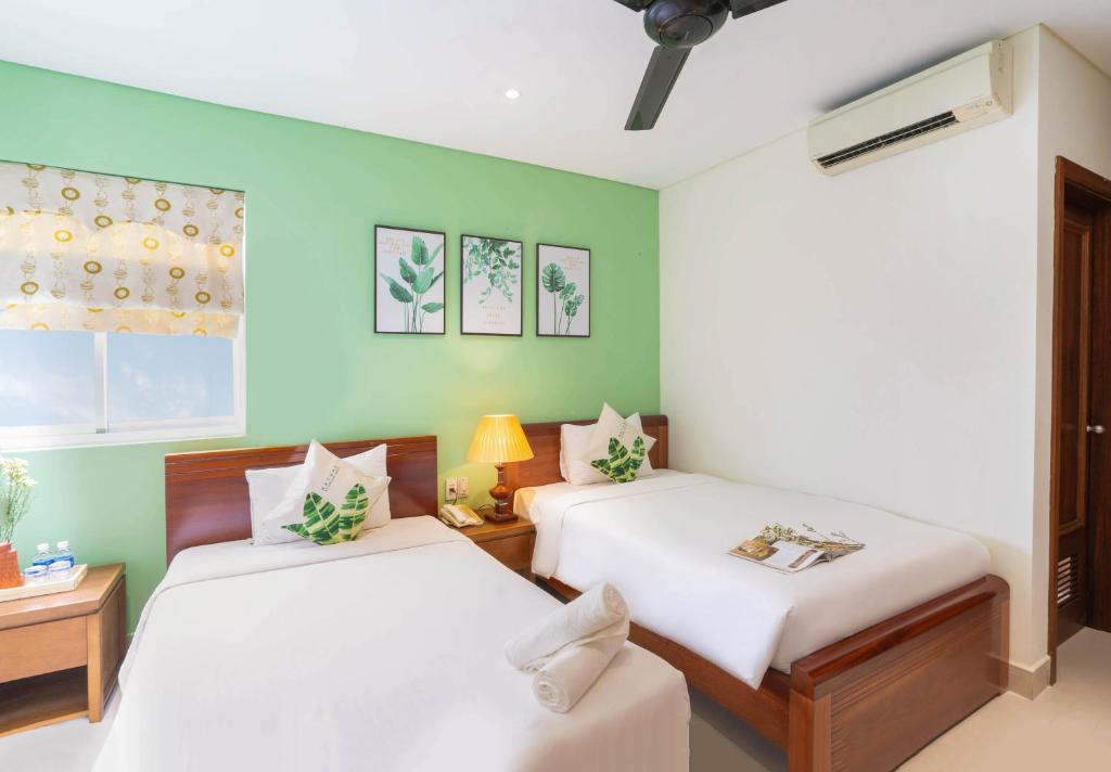 Voodi või voodid majutusasutuse Doha Central Bliss Danang Hotel by Haviland toas