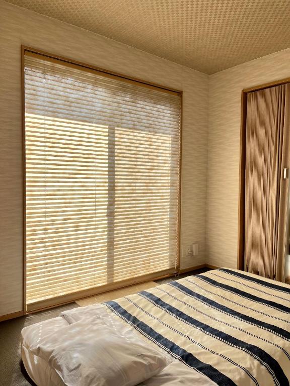 Postel nebo postele na pokoji v ubytování U&T House