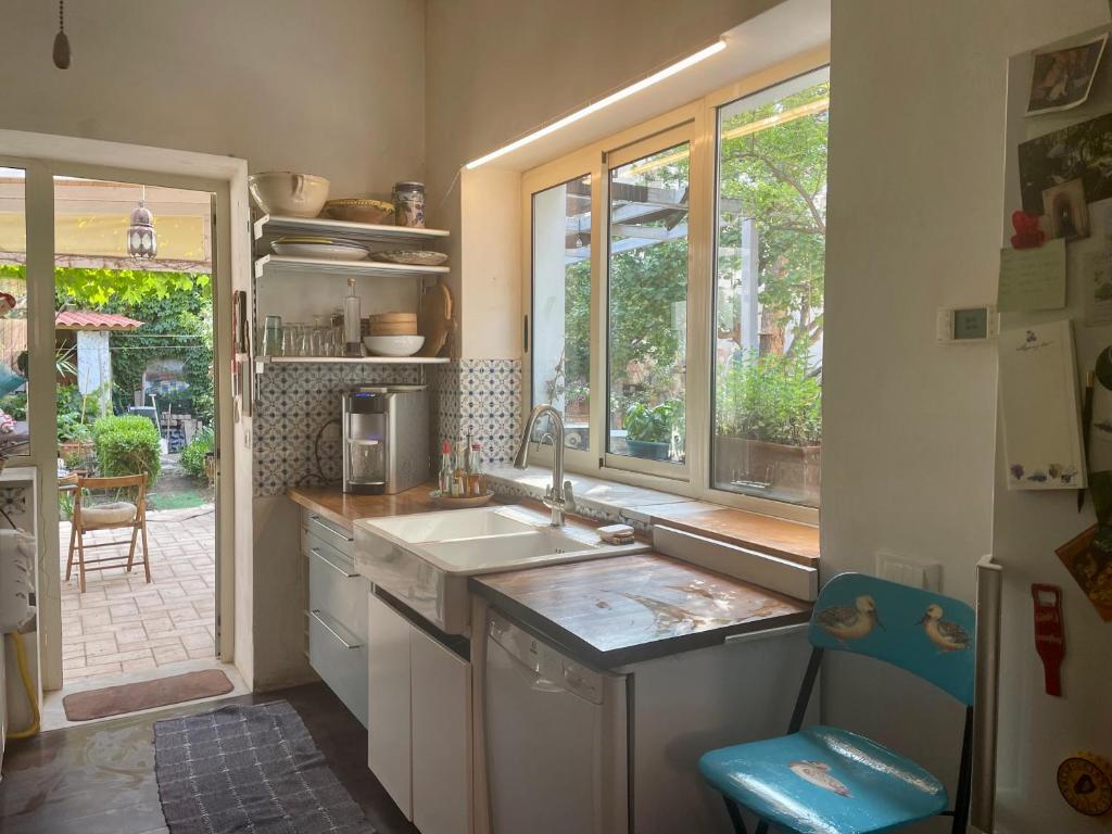 a small kitchen with a sink and a window at Araucaria in Tropea