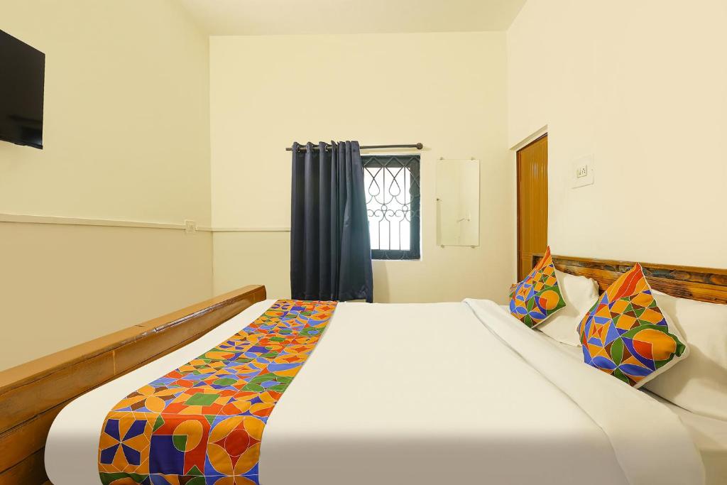 Postel nebo postele na pokoji v ubytování FabExpress Horizon Hideaway - Nr Anjuna Beach