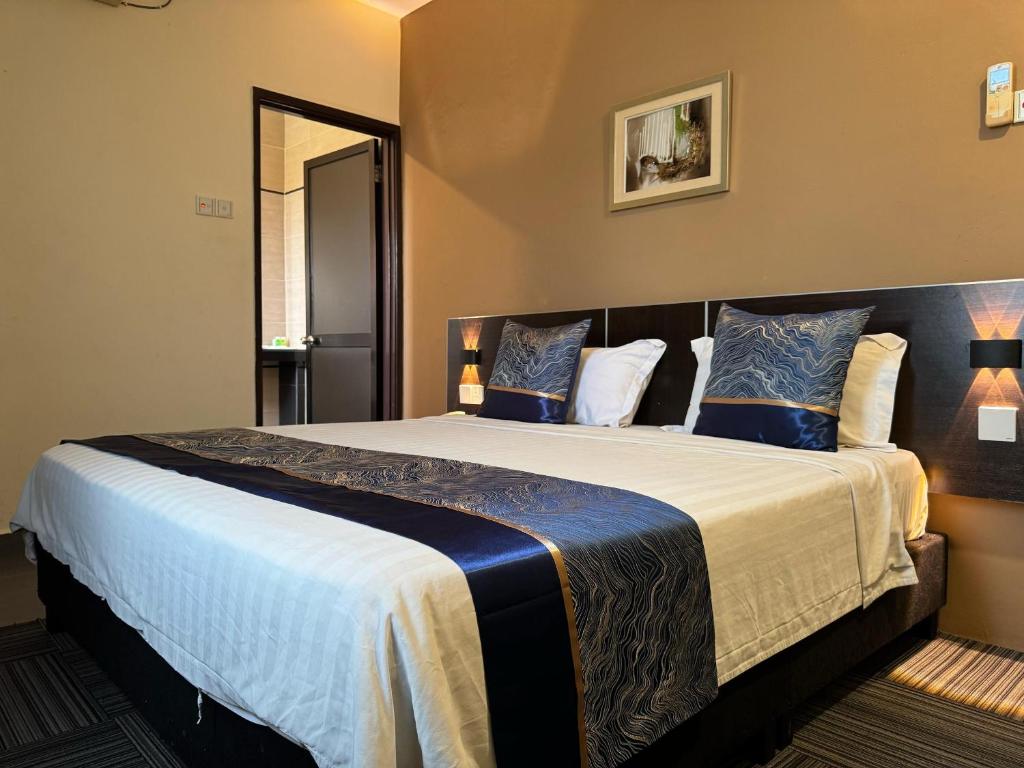 Postel nebo postele na pokoji v ubytování K Garden Hotel (BS)