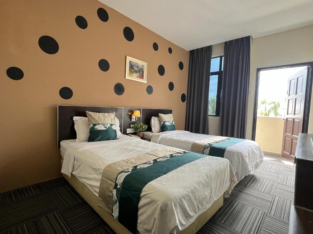 Postel nebo postele na pokoji v ubytování K Garden Hotel (BS)