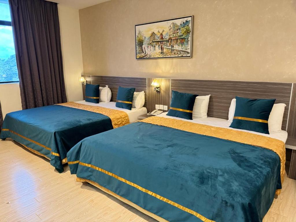 Postel nebo postele na pokoji v ubytování K Garden Hotel (BS)