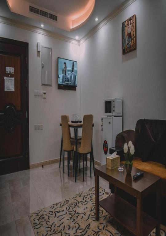 TV a/nebo společenská místnost v ubytování فندق مساكن المني