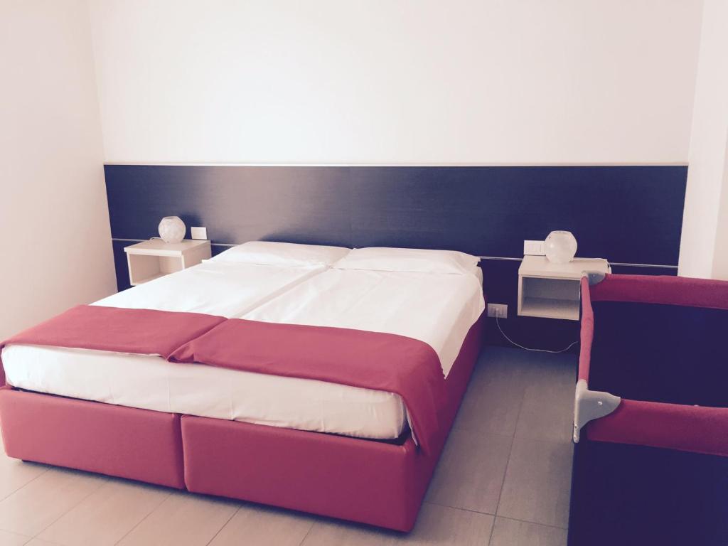 Łóżko lub łóżka w pokoju w obiekcie Residence Villa Paradiso