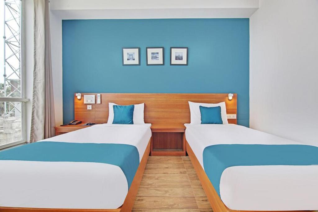 Postel nebo postele na pokoji v ubytování DSquare omr BY K Hotels