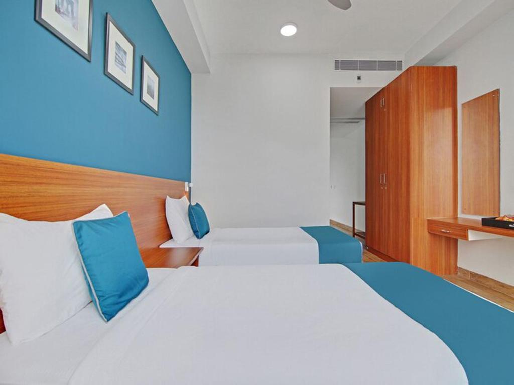 Postel nebo postele na pokoji v ubytování DSquare omr BY K Hotels