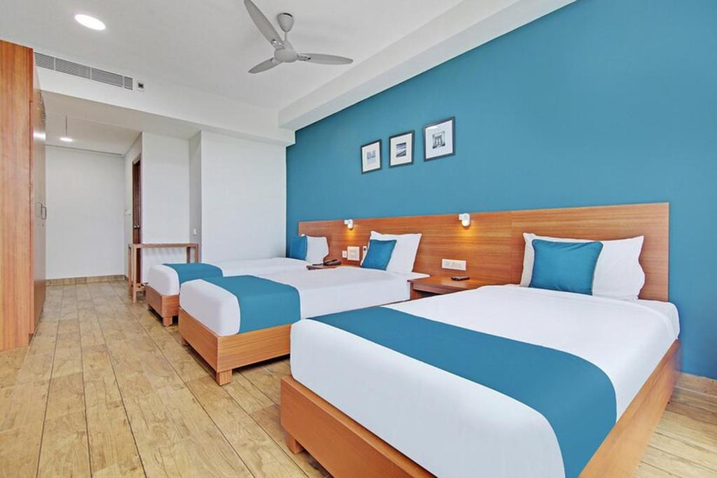 Postel nebo postele na pokoji v ubytování DSquare omr BY K Hotels