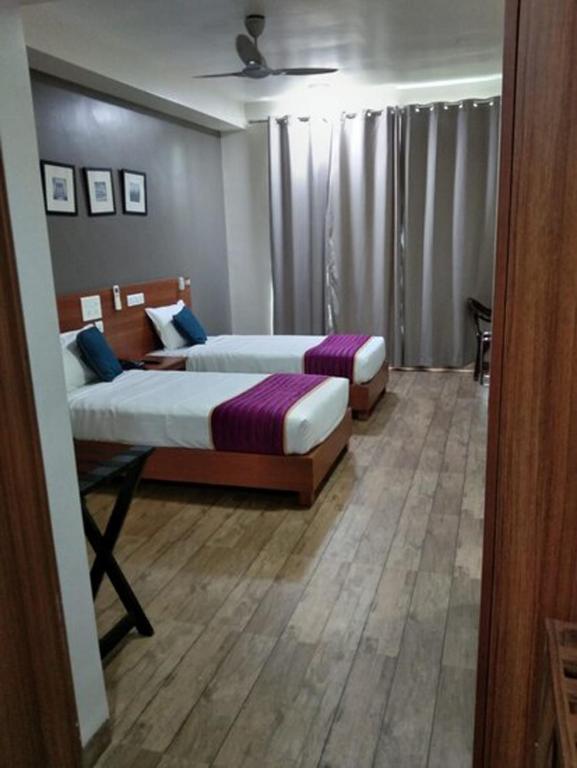 Postel nebo postele na pokoji v ubytování DSquare omr BY K Hotels