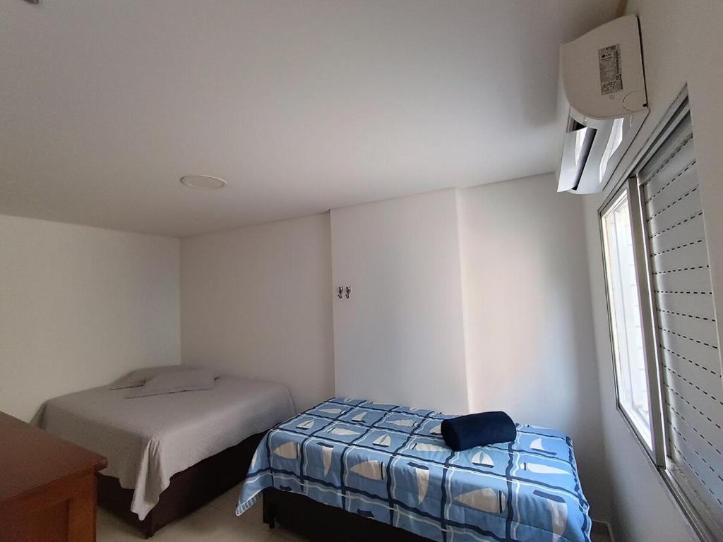 Ένα ή περισσότερα κρεβάτια σε δωμάτιο στο Praia da Guilhermina-PG