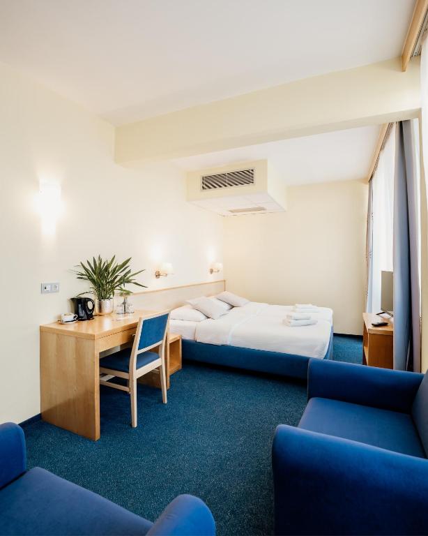 Postel nebo postele na pokoji v ubytování Hotel Jeruzalem