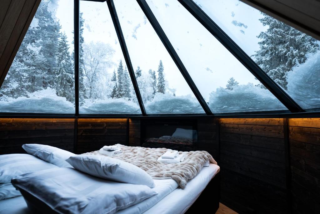 Postel nebo postele na pokoji v ubytování Northern Lights Village Pyhä