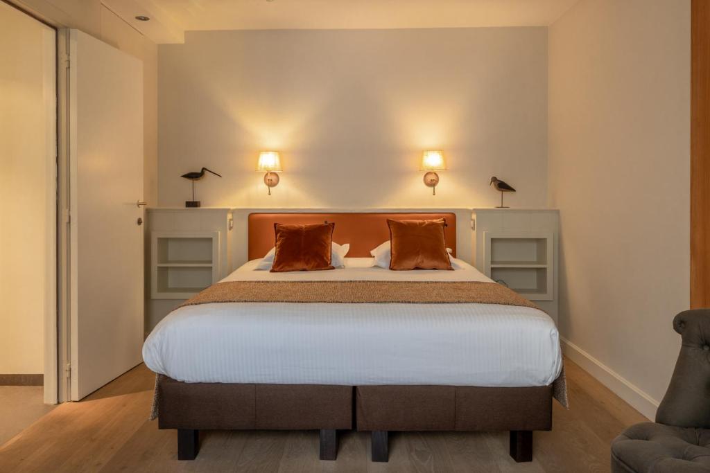Postel nebo postele na pokoji v ubytování Hotel Ter Duinen