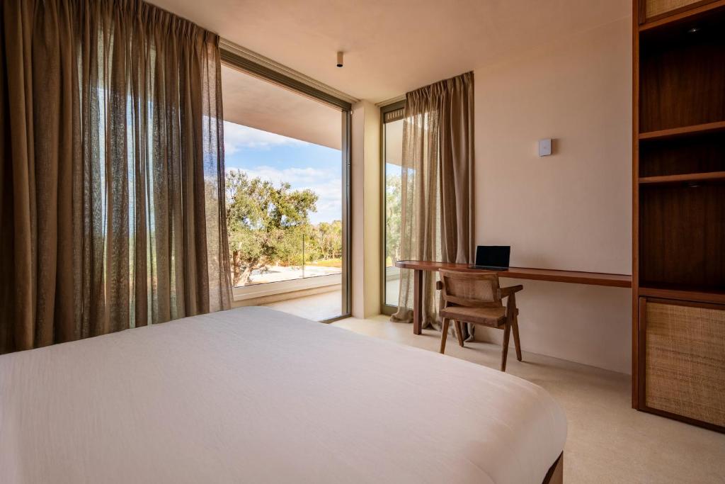 Postel nebo postele na pokoji v ubytování Botanico Villa & Suites