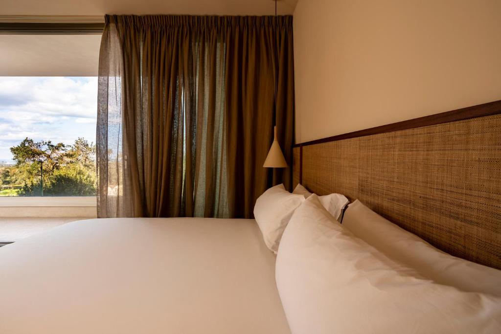 Postel nebo postele na pokoji v ubytování Botanico Villa & Suites