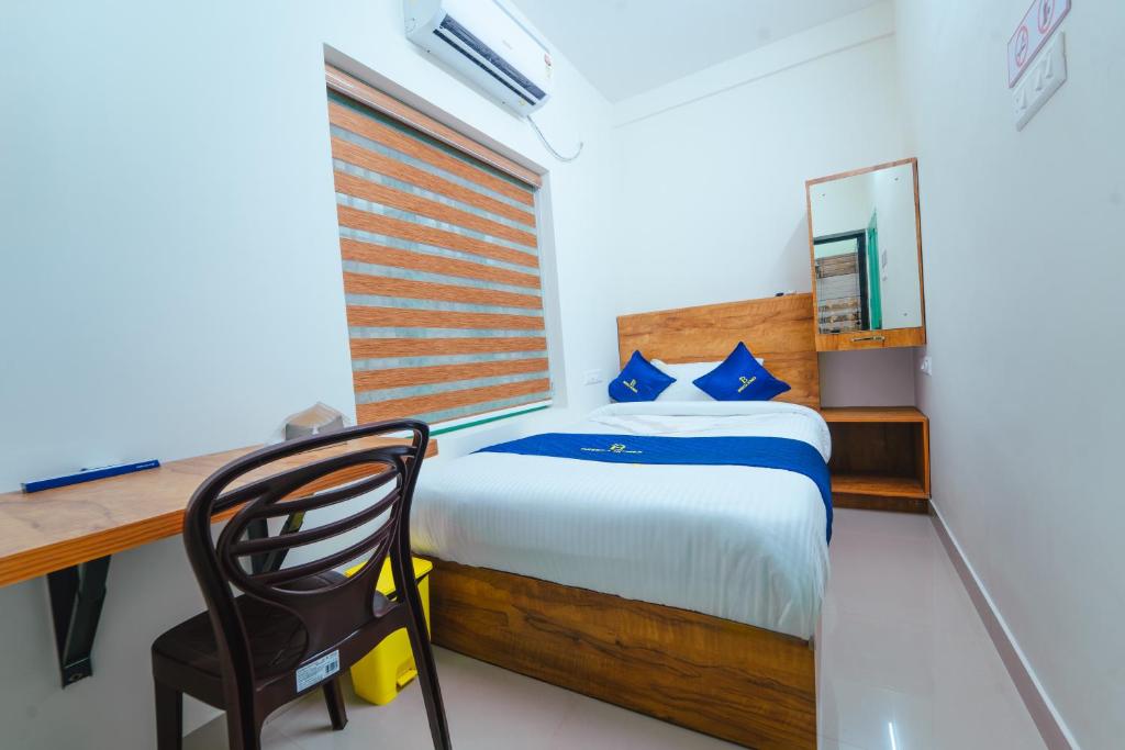 Postel nebo postele na pokoji v ubytování Breeza Homes, Technopark, Trivandrum