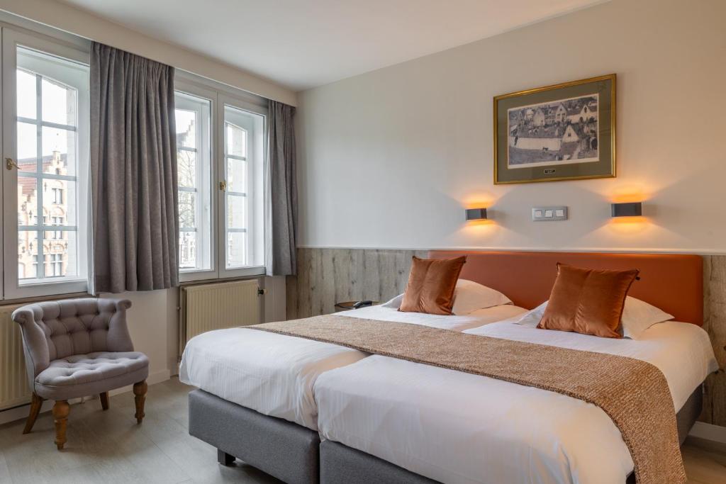 Postel nebo postele na pokoji v ubytování Hotel Ter Duinen
