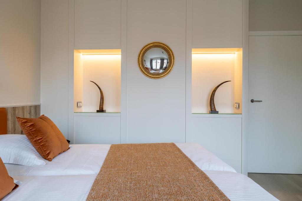 Postel nebo postele na pokoji v ubytování Hotel Ter Duinen