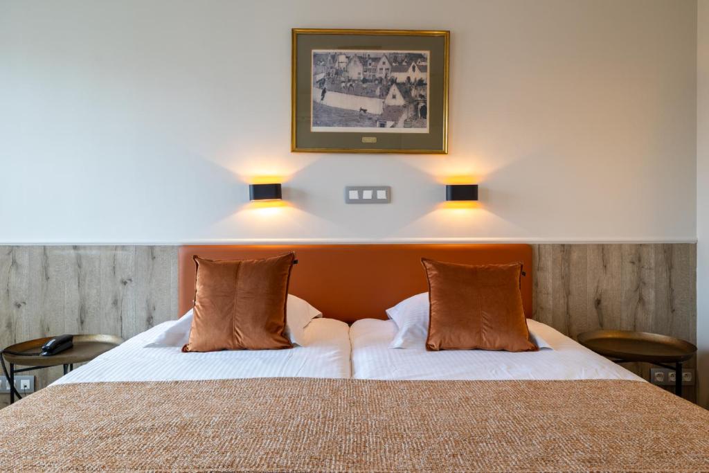 Postel nebo postele na pokoji v ubytování Hotel Ter Duinen