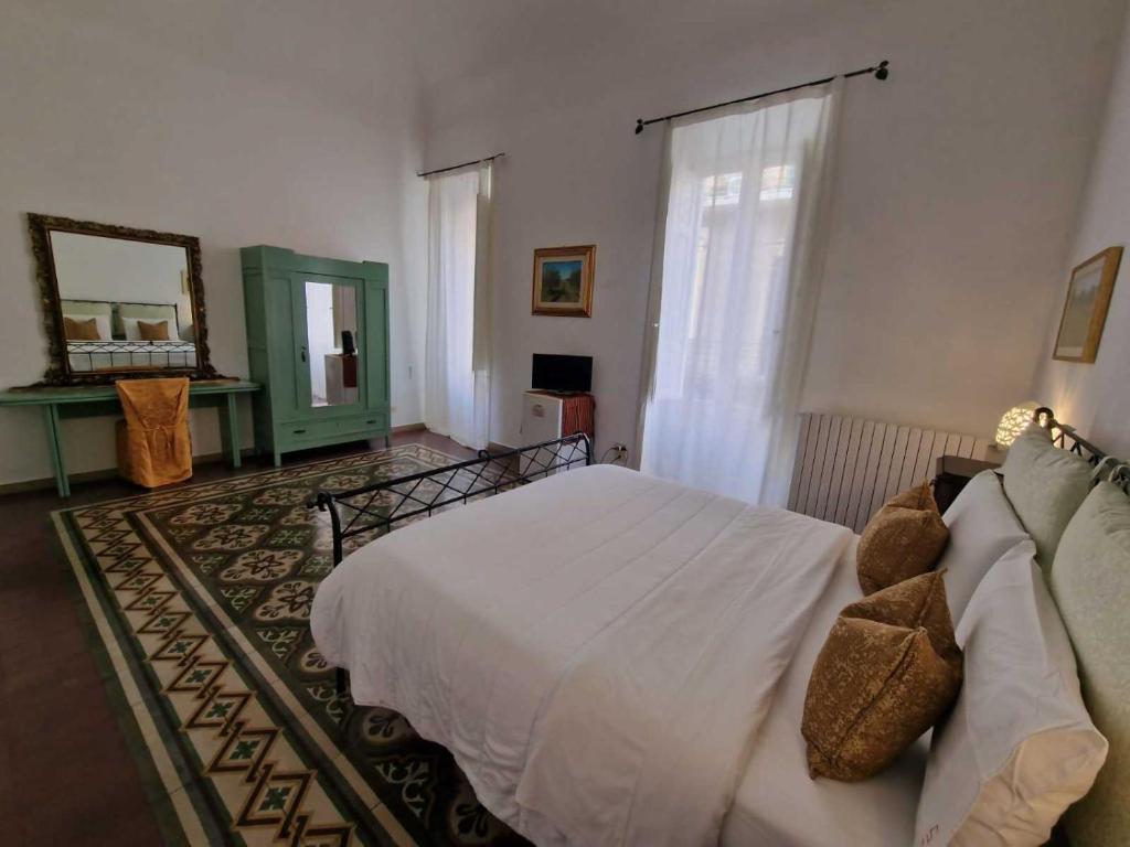 Postel nebo postele na pokoji v ubytování BnB '900 Lecce centro