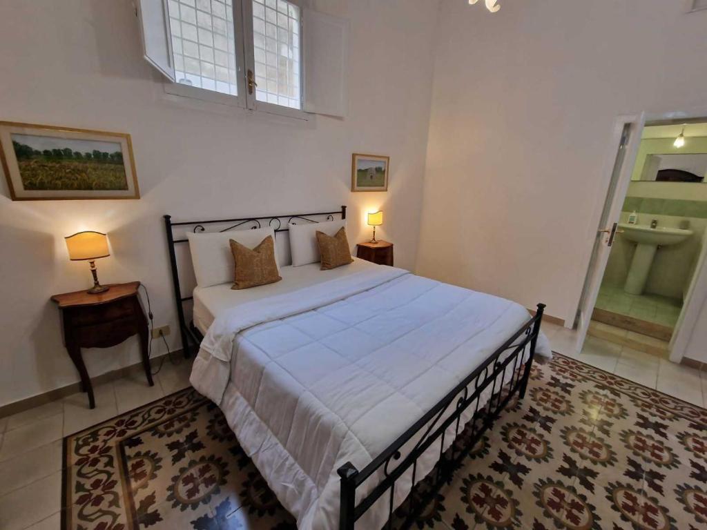 Postel nebo postele na pokoji v ubytování BnB '900 Lecce centro