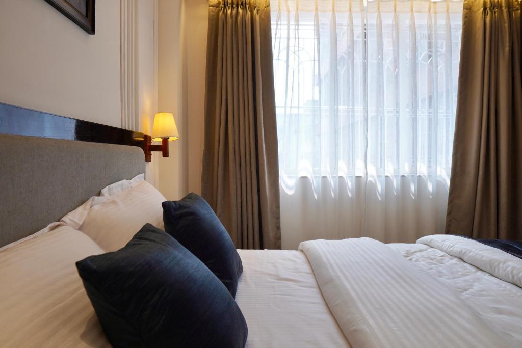 Postel nebo postele na pokoji v ubytování Hotel Ichamati
