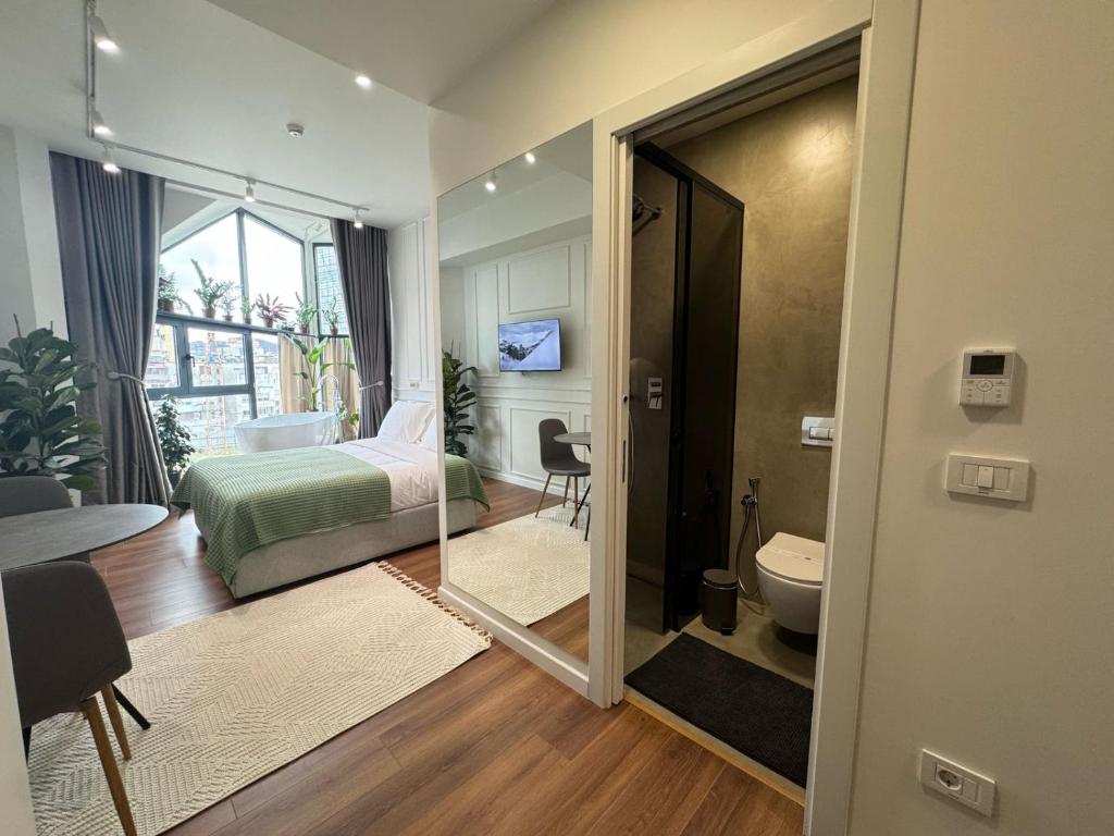 Postel nebo postele na pokoji v ubytování Moonlight Apartments Tirana