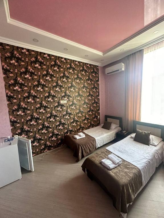 Postel nebo postele na pokoji v ubytování Olympic Gyumri