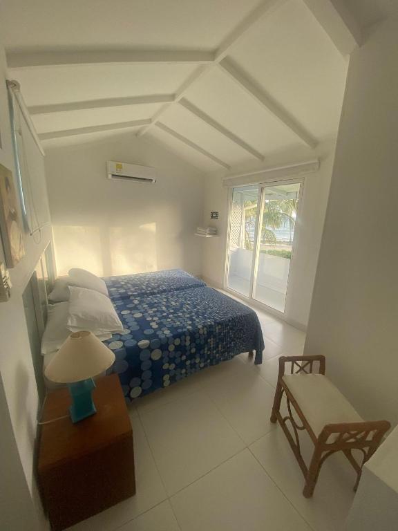Cama ou camas em um quarto em South End Villas - Colombian Caribbean Apartments