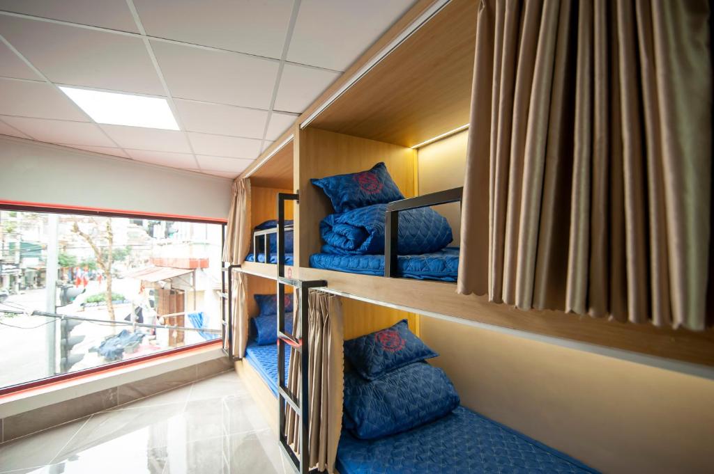 Postel nebo postele na pokoji v ubytování Ma Pi Leng Horizon Hostel - Tour & Motobike rental