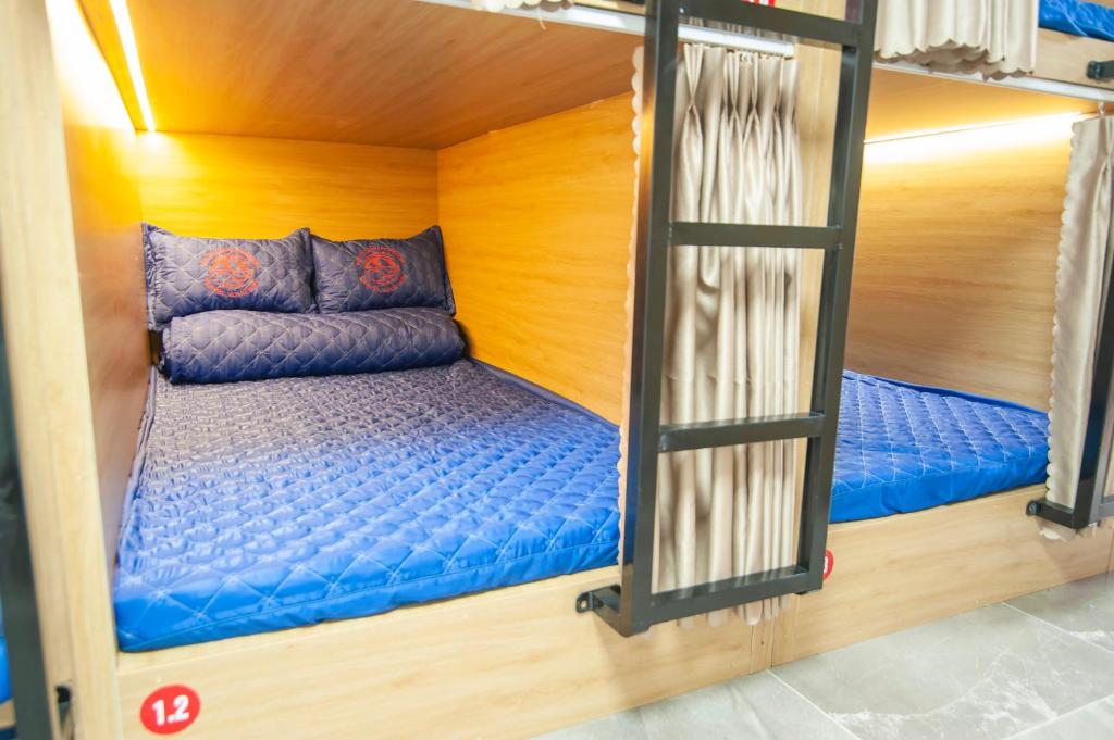 Postel nebo postele na pokoji v ubytování Ma Pi Leng Horizon Hostel - Tour & Motobike rental