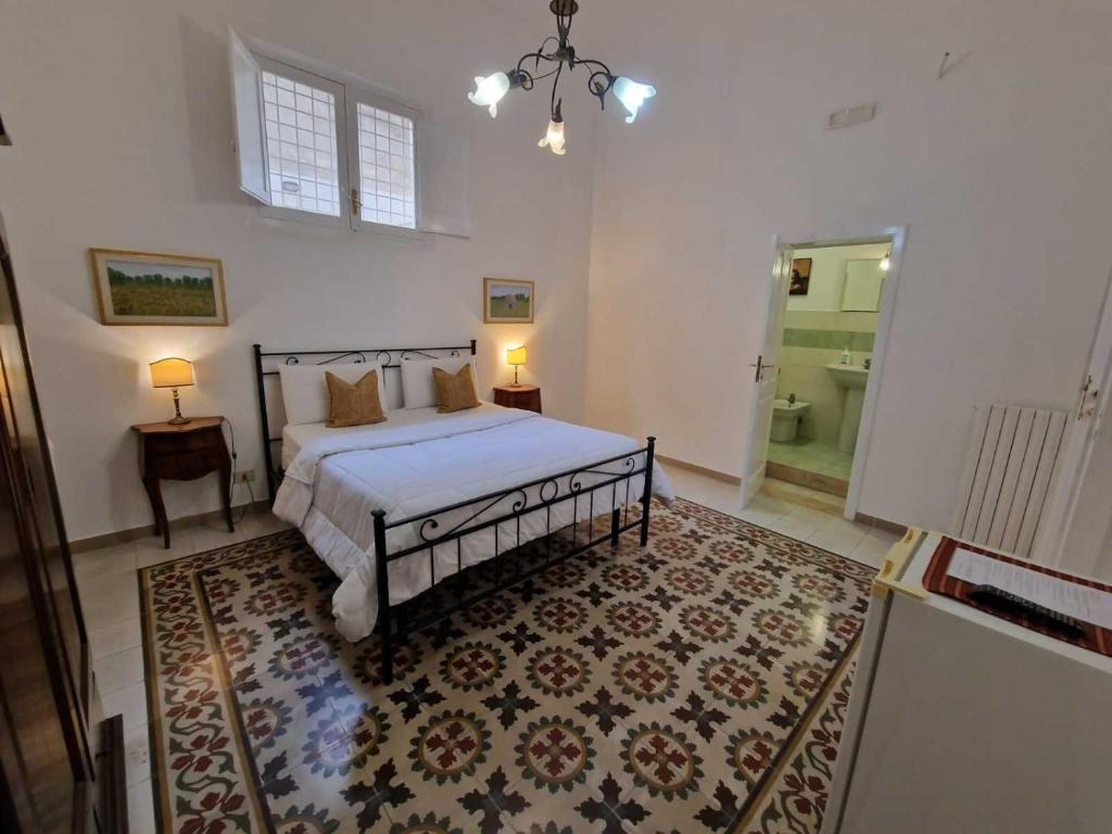 Postel nebo postele na pokoji v ubytování BnB '900 Lecce centro