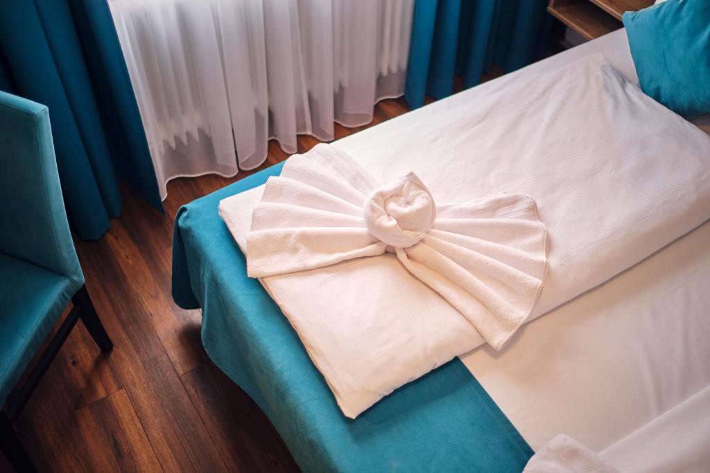 Postel nebo postele na pokoji v ubytování Hotel Hansa Stuttgart City