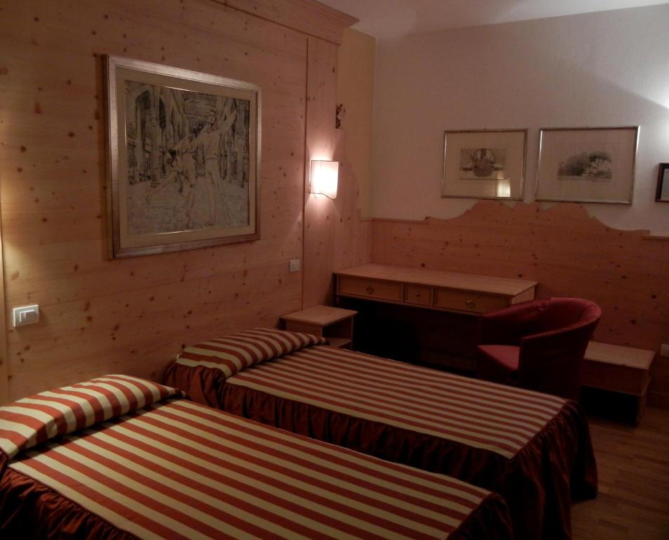 Postel nebo postele na pokoji v ubytování Albergo Da Gildo