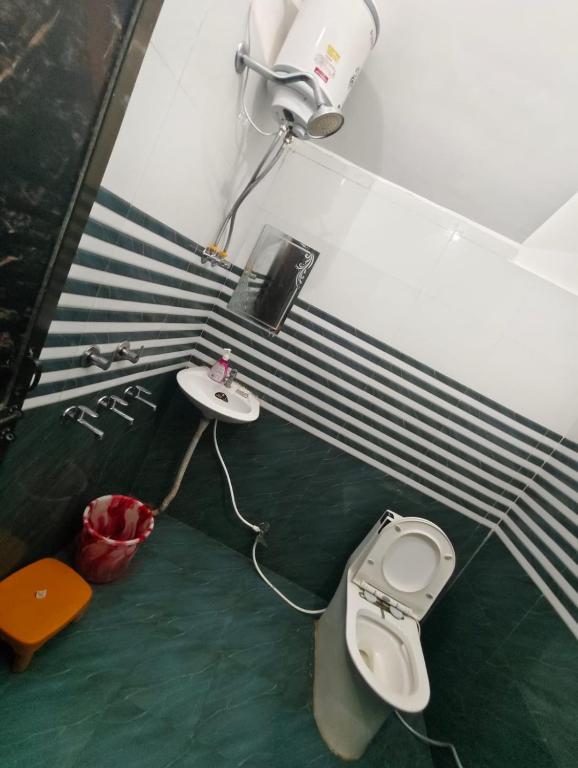 Baðherbergi á Dev Paradise Ayodhya