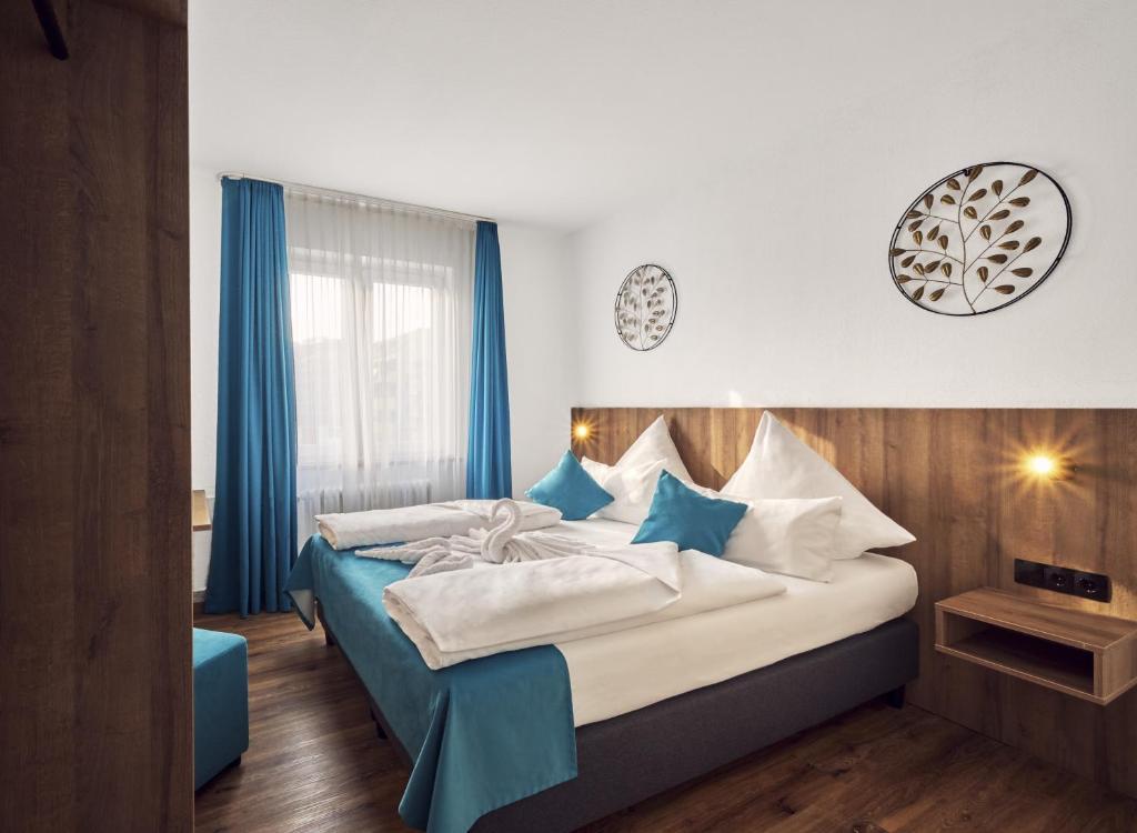 Postel nebo postele na pokoji v ubytování Hotel Hansa Stuttgart City