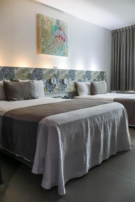 Postel nebo postele na pokoji v ubytování Hotel Punta Azul