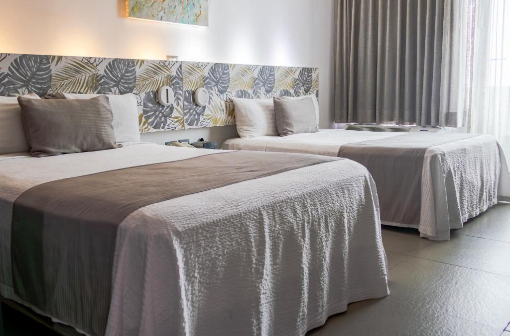 Postel nebo postele na pokoji v ubytování Hotel Punta Azul